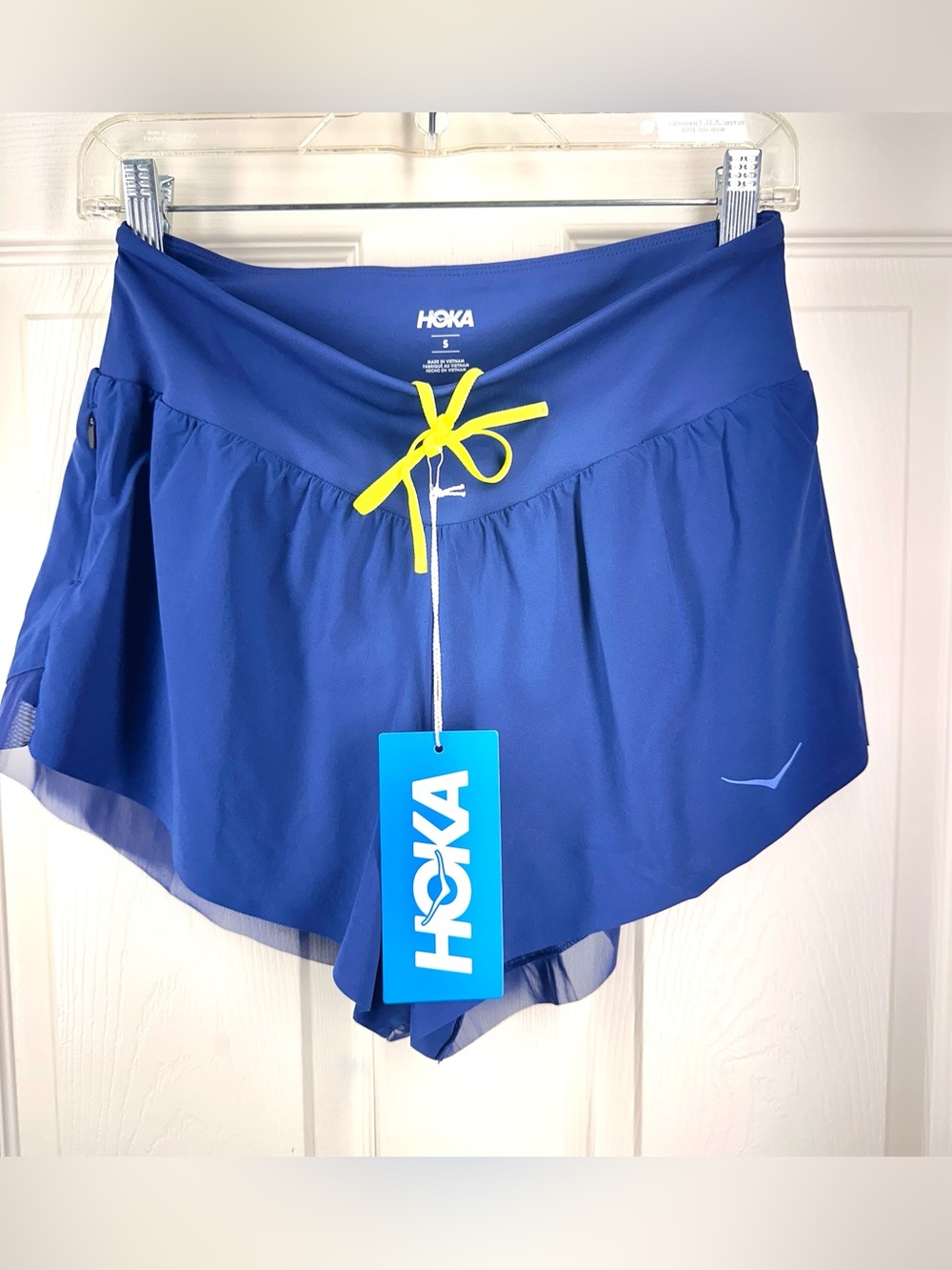 HOKA Women's Glide 4" Running Short in Blue with Yellow Drawstring
